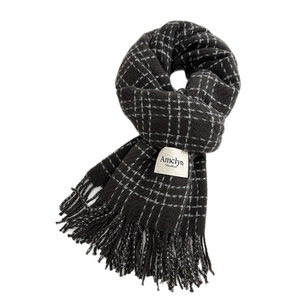 Deep grey checkered scarf with tassel edges and a soft cashmere-like texture