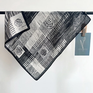 Elegant black and white camellia square silk scarf with artistic textured floral patterns