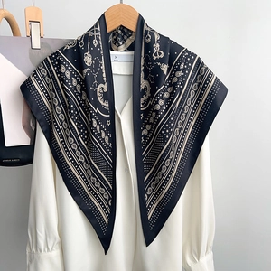 Black and gold paisley pattern twill silk scarf styled with a classic white shirt