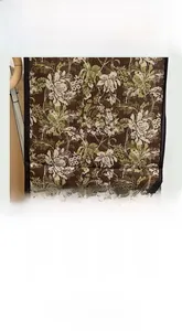 Detail showing soft breathable vintage floral silk-like fabric with elegant brown patterns