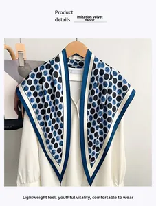 Close-up of minimalist polka dot scarf on white shirt with silk-like velvet texture