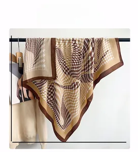 Detail of 90x90cm houndstooth pattern scarf showing fabric texture and elegant brown edges