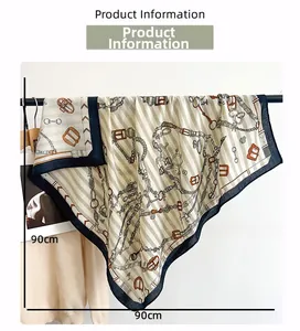 Detail view of 90x90cm scarf showing vintage metal chain prints and soft silk-like texture