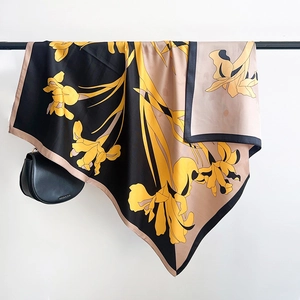 Detail of floral silk scarf hanging with a smooth satin texture and iris flower print