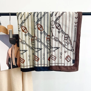 Elegant silk-feel scarf with equestrian chain print in beige, gray, and brown tones