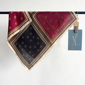 Elegant bohemian geometric square silk scarf in burgundy and gold with leaf patterns