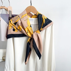 Elegant silk-like floral square scarf featuring yellow blossoms and contrast color blocks