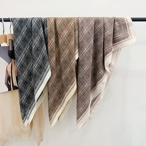 British style retro plaid scarves in four colors hanging on a minimalist black metal rod