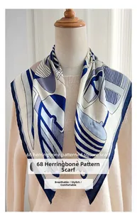 Detailed view of silk-textured scarf with blue herringbone pattern and geometric print