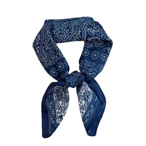 Classic navy blue Paisley square bandana scarf tied in a stylish decorative knot