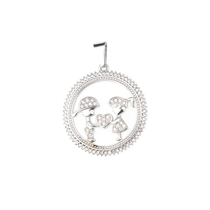 Sparkling silver round pendant with full crystal pavé boy and girl holding a heart charm
