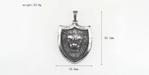 Detail view of lion head shield pendant with size dimensions 52.1mm and weight 33.8g