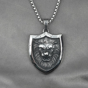 Retro lion head shield pendant necklace in vintage silver finish with a box chain style