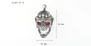 Macro view of skeleton pendant with red zircon eyes showing dimensions 40.3mm by 28.3mm