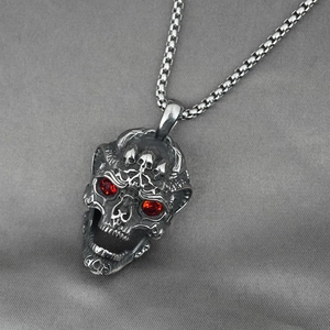 Vintage silver skull pendant necklace with red eye stones and punk gothic engraving
