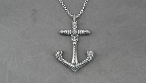 Macro shot of vintage 316L stainless steel anchor skull pendant with crystal details