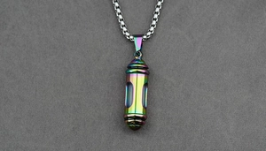 Macro shot of a rainbow-plated stainless steel capsule pendant with box chain