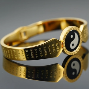 Golden titanium steel bracelet with Tai Chi Yin Yang symbol and engraved scriptures