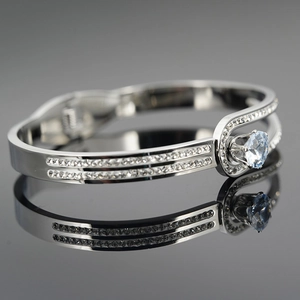 Modern silver-colored belt buckle style bracelet with pave-set zircon crystals