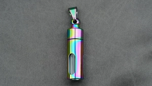 Macro shot of iridescent rainbow cylindrical pendant with clear glass viewing window