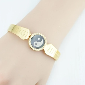 Gold open bangle featuring Yin Yang motif and engraved Buddhist Heart Sutra scriptures