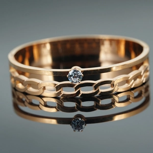 Bracelet tressé élégant en or rose avec décoration en cristal et texture gourmette