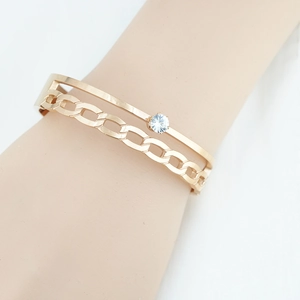 Bracelet double couche en or rose avec maille tressée et accent en zircone cubique