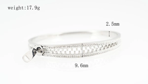 Detailed close-up of a silver zipper bangle with zircon inlay and exact weight measurements