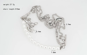 Detail view of multilayer pearl necklace with OT toggle clasp and silver steel chain