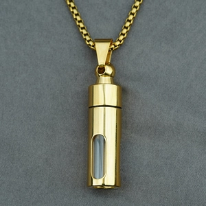 Golden cylindrical pendant necklace with a glass window and sturdy square box chain