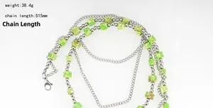 Detail of multi-layer chain with silver beads and marble pattern cube beads lobster clasp