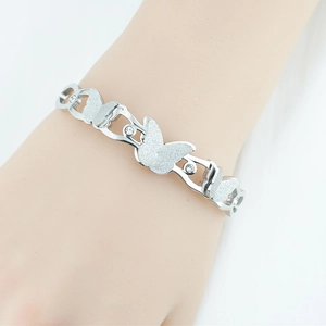 Elegant silver butterfly bracelet with sandblasted finish and sparkling crystal center