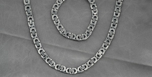 Detail of vintage Byzantine style chain set with aged steel finish and industrial texture