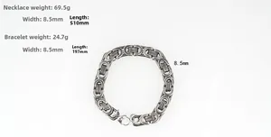Close-up of industrial steel curb chain with lobster clasp and heavy metal link details