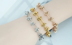 Close-up of titanium steel double-layer braided knot bracelets in gold and silver
