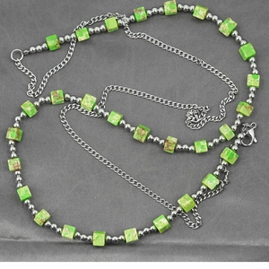 Long beaded necklace featuring green turquoise stones and silver-tone steel round beads