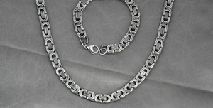 Detailed view of Byzantine style stainless steel chain necklace and bracelet set