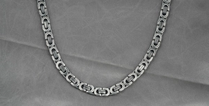 Close-up of vintage silver stainless steel Byzantine chain with industrial link details