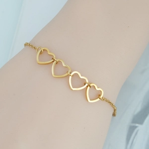 Elegant gold-plated stainless steel bracelet featuring hollow heart-shaped charms for women