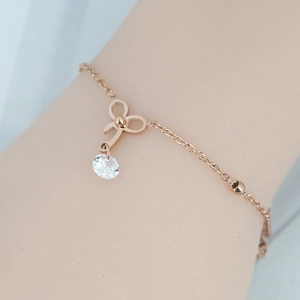 Bracelet élégant en or rose avec pendentif nœud et pierre de zircon pour femmes