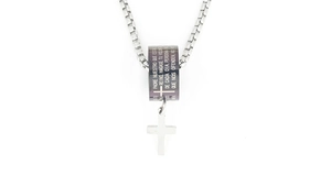 Detail of cross pendant necklace with engraved Spanish Lord's Prayer on cylinder charm