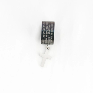 Black stainless steel cross ring pendant with Spanish prayer engraving on white background