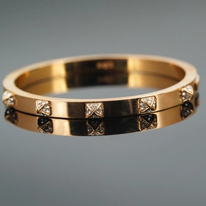 Elegant rose gold plated stainless steel bangle with square rhinestone-encrusted studs