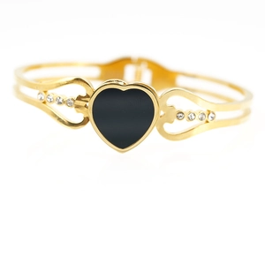 Elegant gold-plated open bangle with black enamel heart and sparkling crystals for women