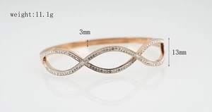 Detail showing rose gold plated hollow infinity bangle with sparkling pavé zircons