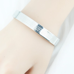 Titanium steel mantra cuff bracelet with silver finish and engraved Chinese characters