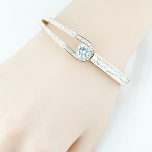 Elegant gold titanium steel bracelet for women with crystal inlay and round center stone