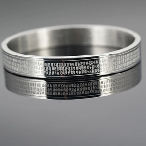 Polished silver titanium steel bangle with laser-engraved Buddhist scriptures