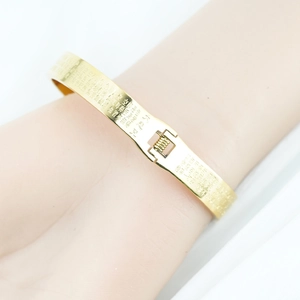 Polished gold plated stainless steel mantra bangle with Chinese engraving for women