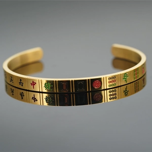 Golden mahjong-themed titanium steel open bangle featuring red and green carved tiles